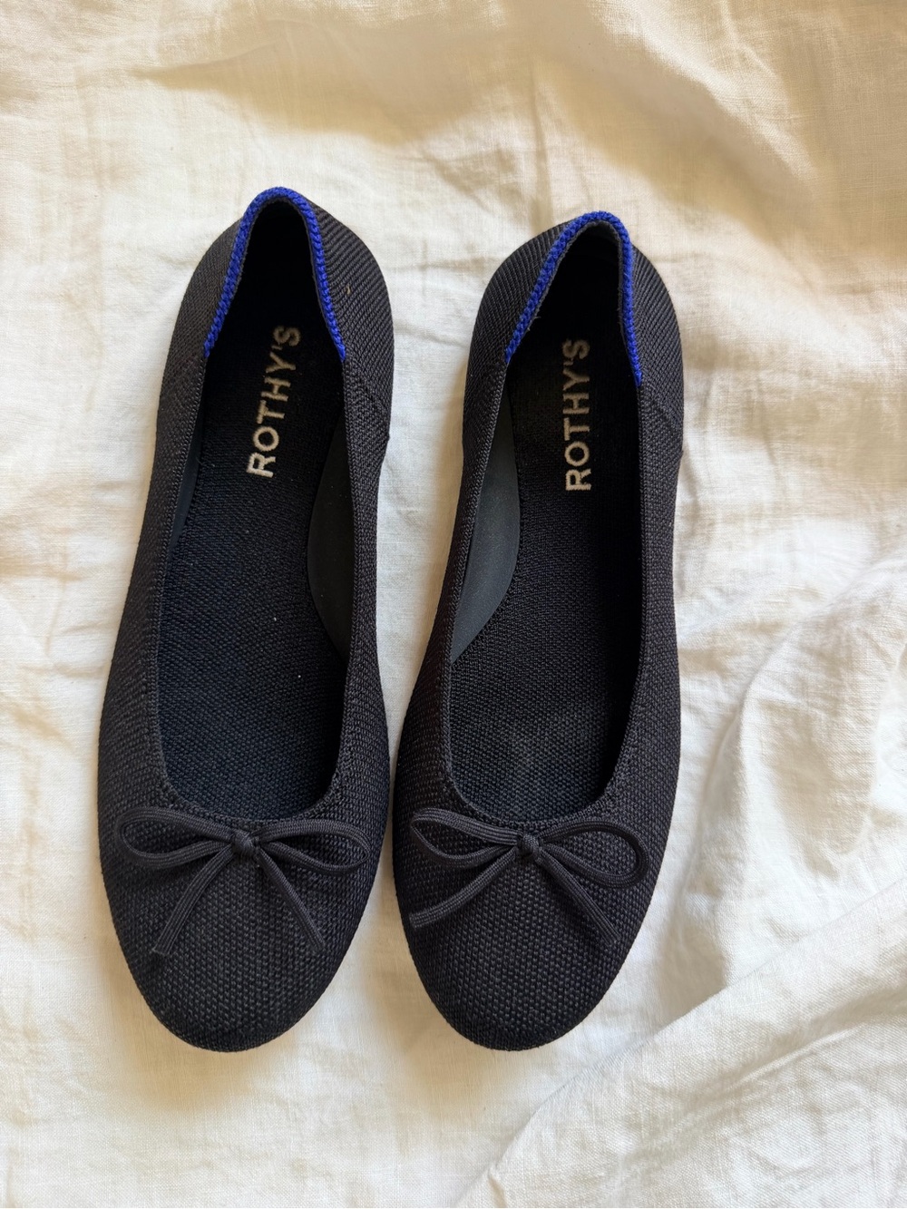Rothy's Black Knit Ballet Flats with Blue Heel Trim